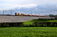 66726 heads the Royal Scotsman stock past Carnforth on 10.3.19 with a Eastleigh to Hamilton EG Steele sdgs move.