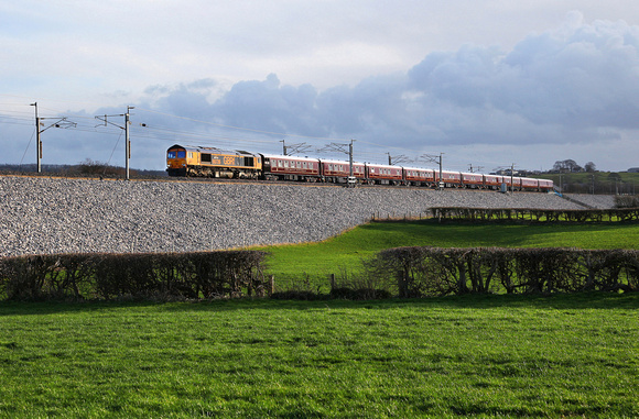66726 heads the Royal Scotsman stock past Carnforth on 10.3.19 with a Eastleigh to Hamilton EG Steele sdgs move.