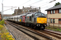 37800 hauling 365519 and 365529  passes Carnforth on 10.7.19 with its Motherwell T.M.D. to Crewe South Yard move.