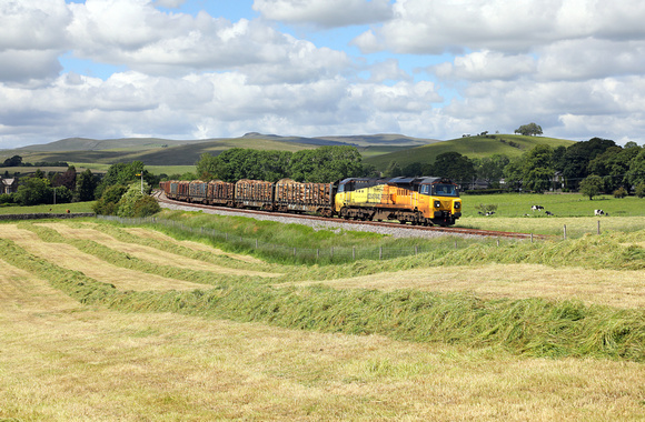 70801 heads away from Hellifield at Goosemere Heights with the Carlisle to Chirk logs.