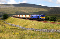 After runround, 66727 heads south at Ribblehead with 6M33 1125 Arcow Quarry to Pendleton.