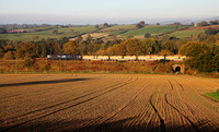 66421 hauls the previous days Mountsorrell to Carlisle away past Long Strumble after failing the night before. Some skates had been put under a wagon so it could be moved.