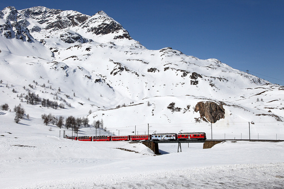 A St Moritz to Tirano service heads away from Bernina Lagalb.