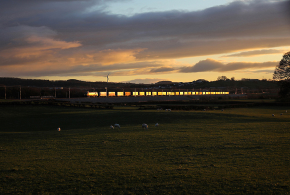 88010 heads away from Carnforth on 5.1.21 with 4S44 Daventry to Mossend.