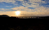 70807 heads over Ribblehead viaduct on 15.1.22 with the Carlisle to Chirk logs.