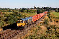 66766 heads past Kings Sutton on 10.8.22 with a Southampton Western Docks to Trafford Park liner.
