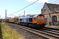 66731 passes Carnforth 0n 26.7.22 with the new Hams Hall to Mossend liner service.