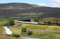 66784 heads away from Ribblehead viaduct on 7.7.22 with the Ribblehead to Hunslet stone service.
