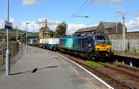 88001 & 88010 passes Carnforth with 6C51 to Heysham.