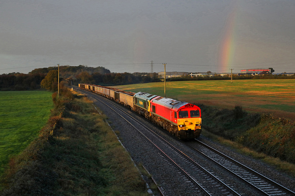 59205 passes Berkley on 26.10.20 under stormy skies with its Whatley to Southampton stone train.