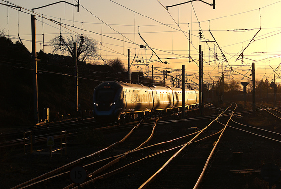 1S66 14.07 Manchester Airport to Edinburgh passes Carnforth in the last light on 25.11.20.