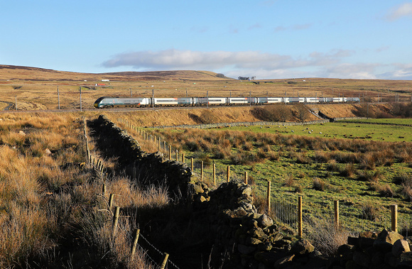 390043 climbs past Shap wells on 13.1.22 with 1S52 10.30 London Euston to Glasgow Central.