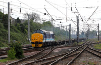 37425 passes Carnforth on 3.5.22 with a Bescot to Mossend empty flat move.