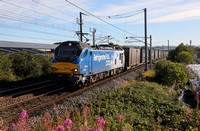 88010 passes Carnforth on 30.8.22 with 4M27 05.46 Mossend  to Daventry