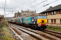 57307 drags 390005 pass Carnforth on 12.6.24 with a Plumpton goods loop to Longsight move.