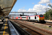 67008 heads away from Chester on 4.8.22 with 1W93 11.22 Cardiff Central to Holyhead.