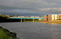 Avanti 390154 heads over the River Lune on Carlisle Bridge at Lancaster on 16.7.24 with 1S90 17.30 London Euston to Glasgow Central.