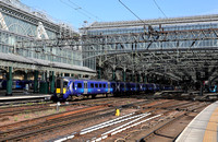 385018 heads away from Glasgow Central on 18.7.22.